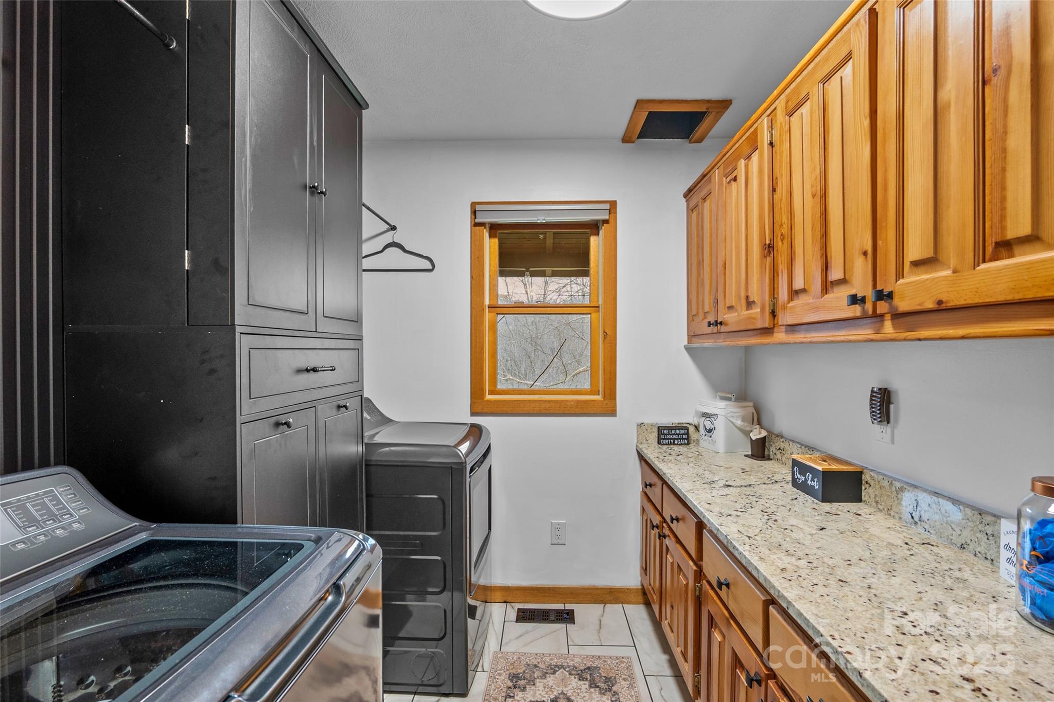 145 Keener Road Canton, NC 28716 - Photo 30 of 48 a kitchen with granite countertop a sink stove and cabinets