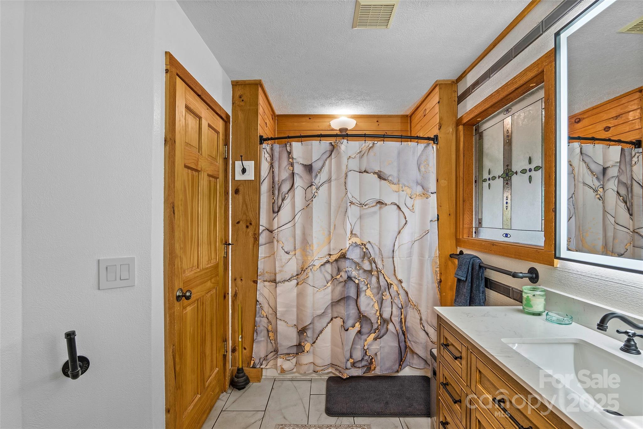 145 Keener Road Canton, NC 28716 - Photo 31 of 48 a bathroom with a sink and a mirror