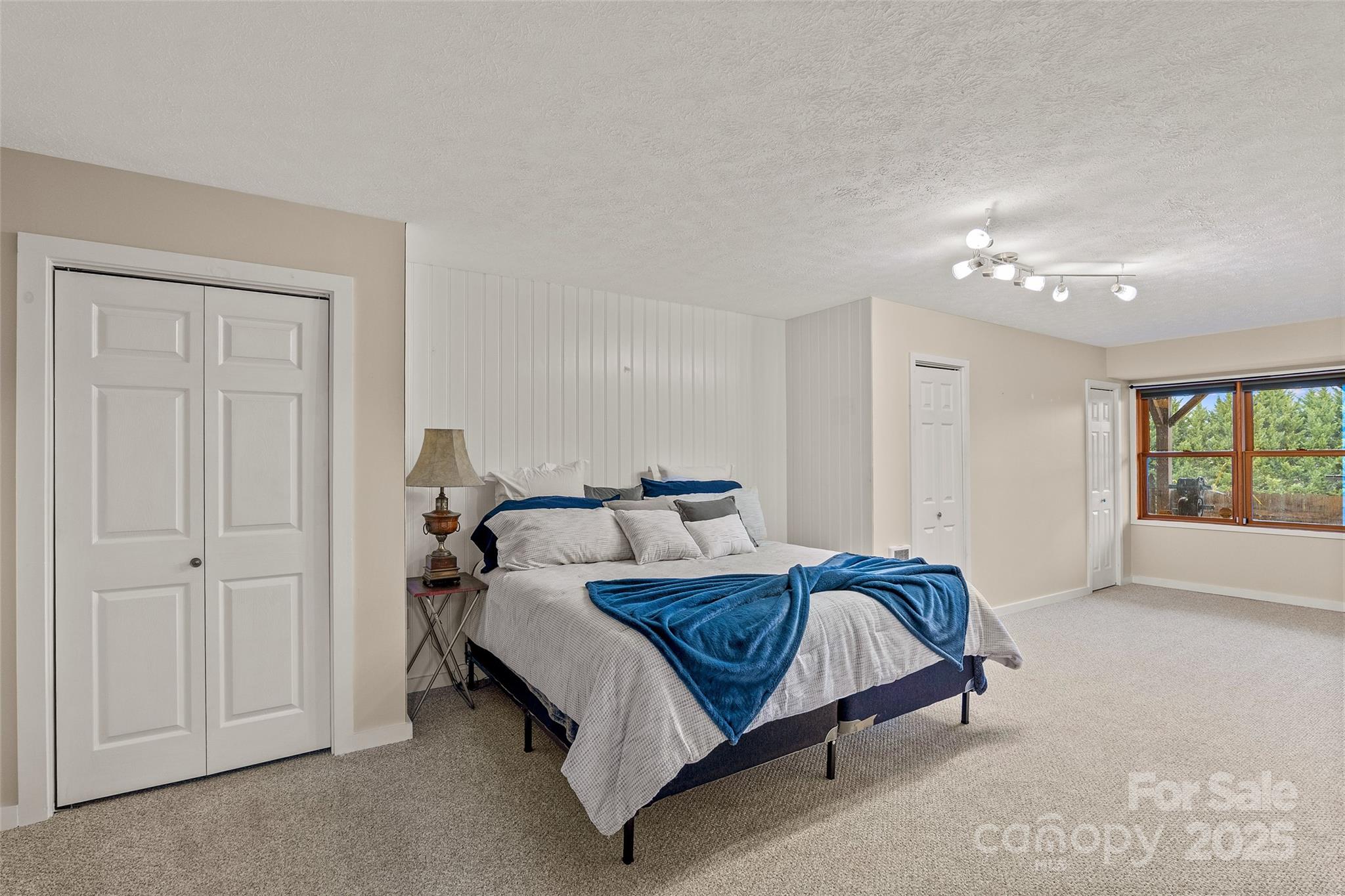 145 Keener Road Canton, NC 28716 - Photo 44 of 48 a bedroom with a bed and window