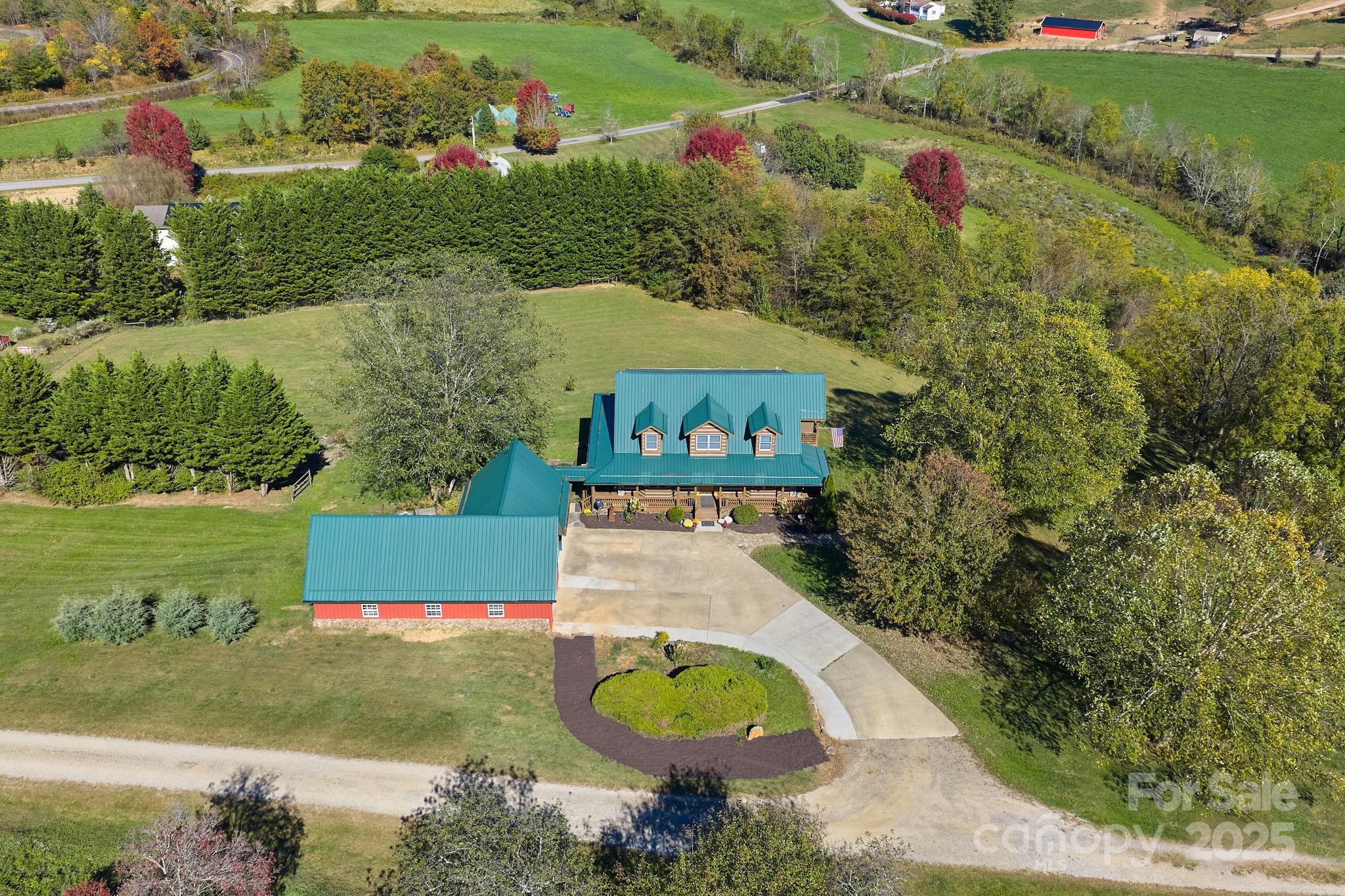 145 Keener Road Canton, NC 28716 - Photo 5 of 48 an aerial view of a house with yard swimming pool and outdoor seating