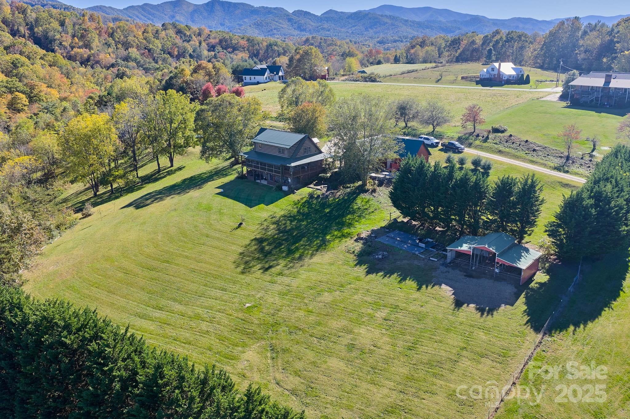 145 Keener Road Canton, NC 28716 - Photo 10 of 48 a view of a lake with a mountain
