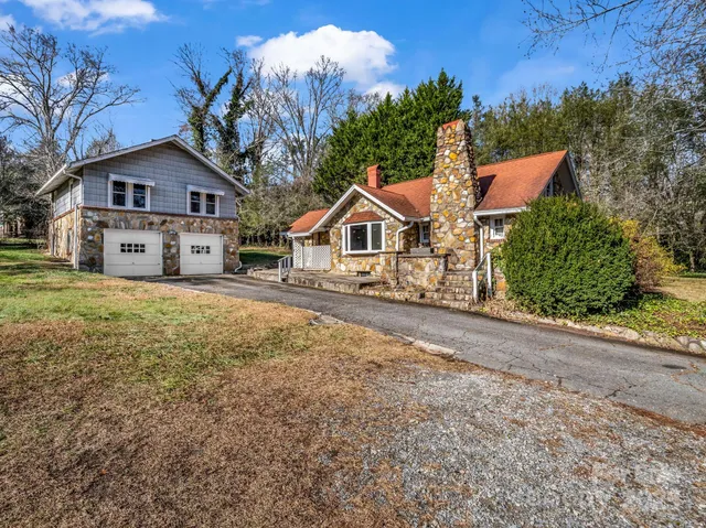 a house that has a tree in front of it