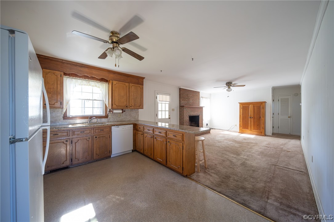 501 Country Club Road Keysville, VA 23947 - Photo 2 of 14 a large kitchen with a refrigerator a sink dishwasher stove and white cabinets