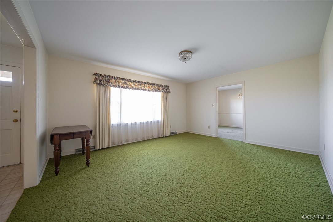 501 Country Club Road Keysville, VA 23947 - Photo 5 of 14 a view of an empty room with window and hardwood floor