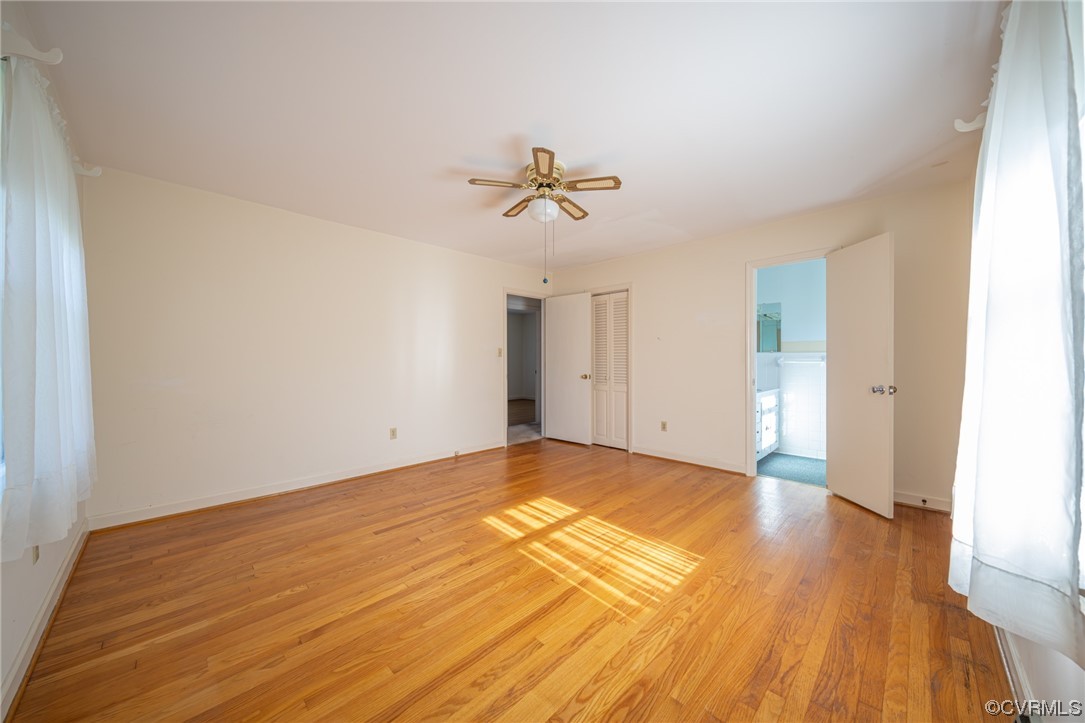 501 Country Club Road Keysville, VA 23947 - Photo 7 of 14 a view of a room with wooden floor and a ceiling fan