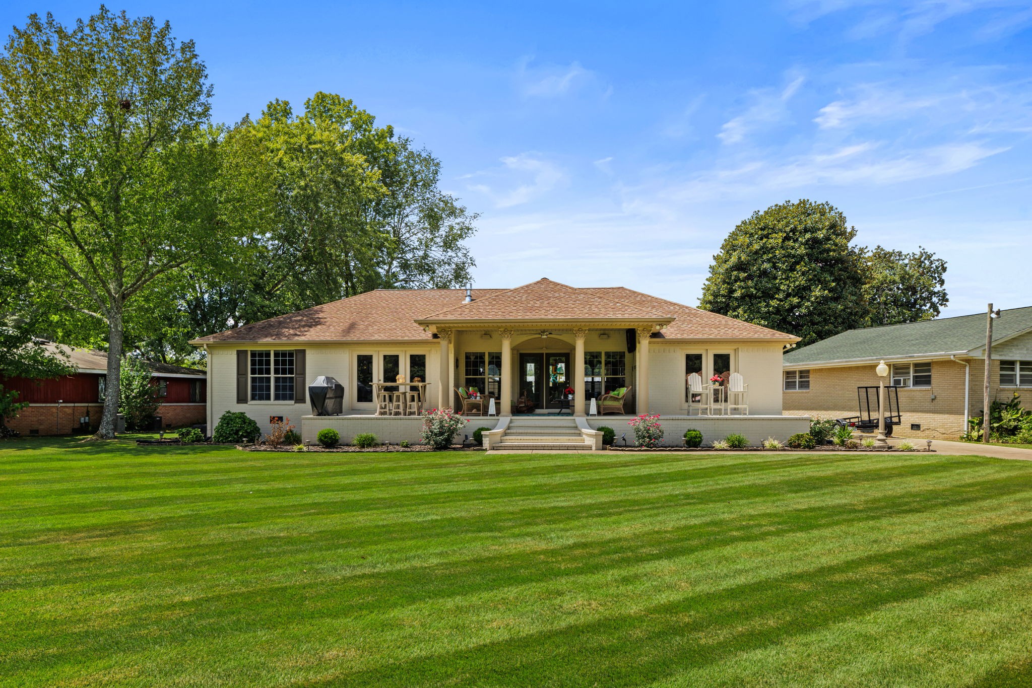 a front view of a house with garden