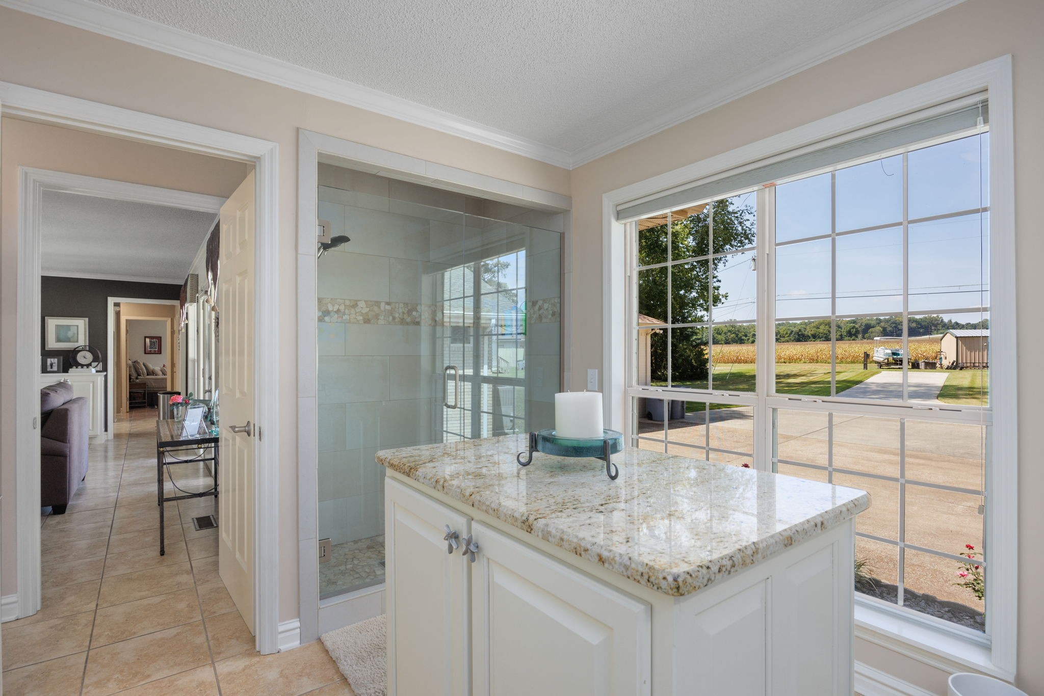 568 County Road 322 Florence, AL 35634 - Photo 21 of 60 a kitchen with granite countertop a sink and cabinets