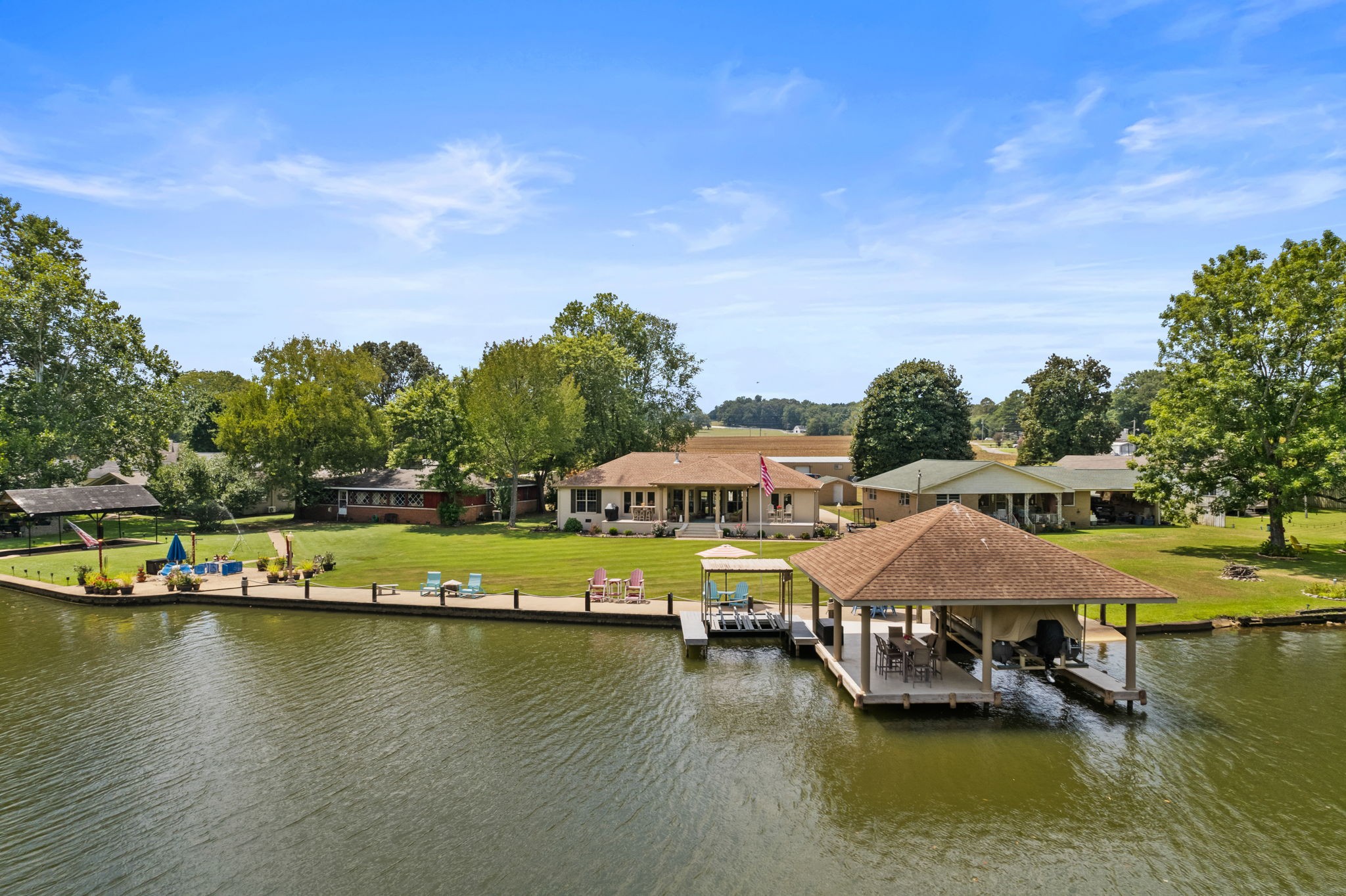 568 County Road 322 Florence, AL 35634 - Photo 44 of 60 a view of swimming pool with outdoor seating and lake view