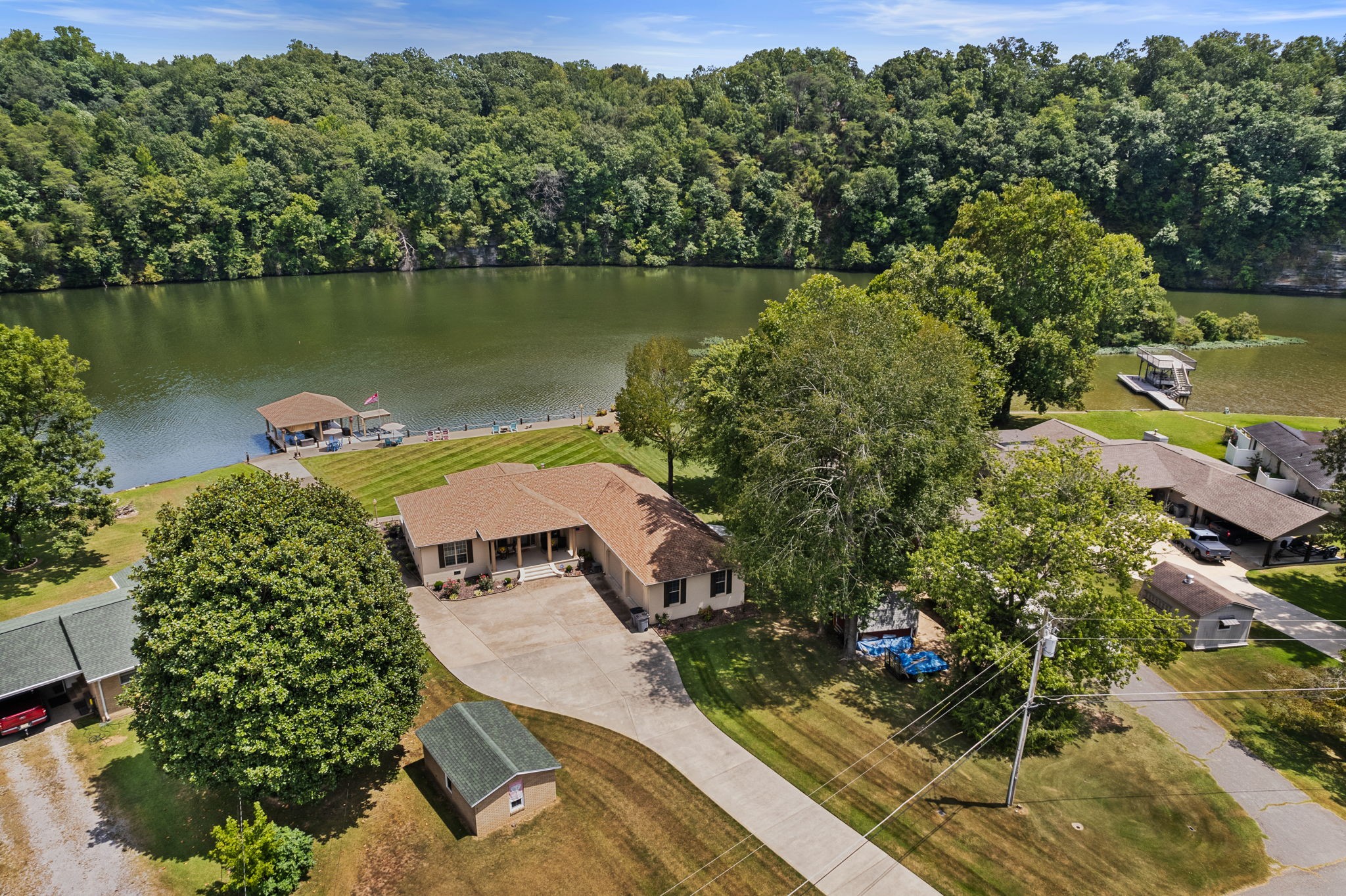 568 County Road 322 Florence, AL 35634 - Photo 7 of 60 an aerial view of a house with a garden and lake view