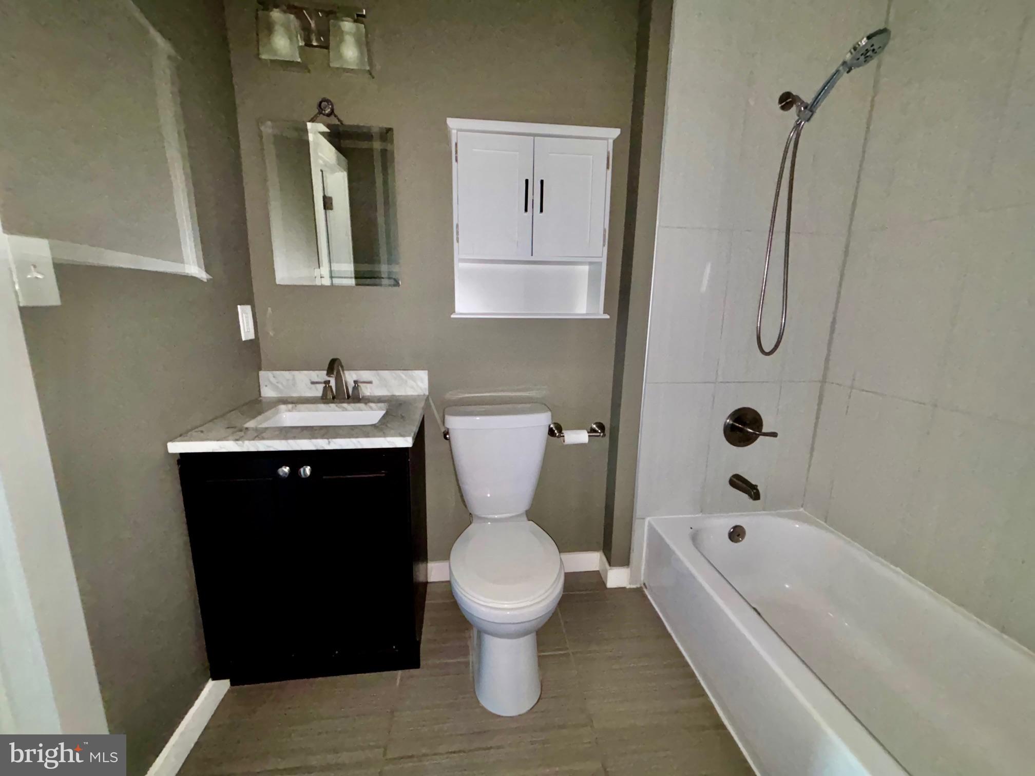 1865 Frankford Avenue, Unit B Philadelphia, PA 19125 - Photo 9 of 12 a bathroom with a sink toilet and shower