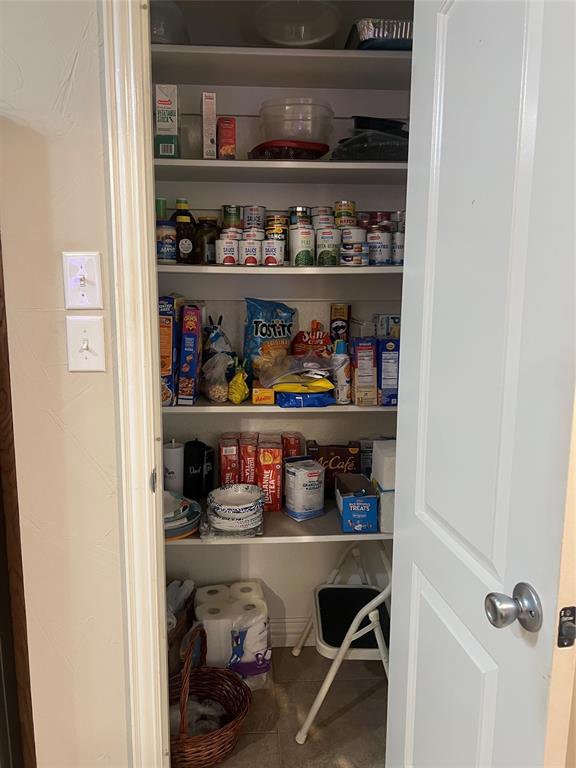 312 McAfee Street Mabank, TX 75147 - Photo 32 of 40 a room with wooden shelves