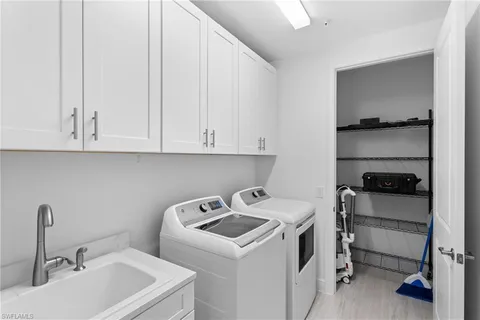 a view of bathroom and sink with washing machine