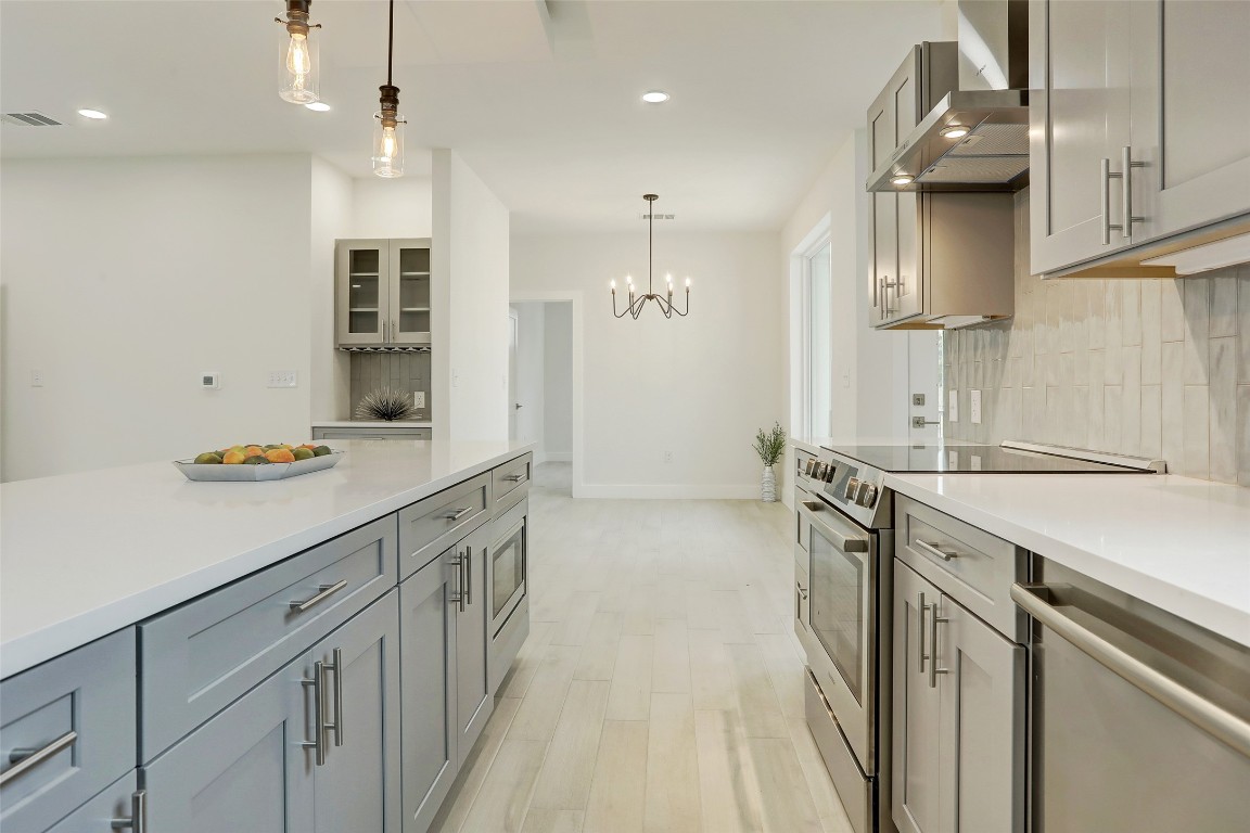 4300 Mansfield Dam Road, Unit 1421 / 1431 Austin, TX 78734 - Photo 5 of 32 a kitchen with a sink stove and refrigerator