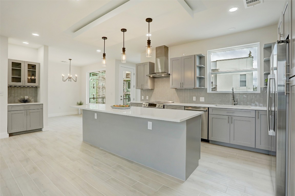 4300 Mansfield Dam Road, Unit 1421 / 1431 Austin, TX 78734 - Photo 7 of 32 a large kitchen with cabinets and a stainless steel appliances