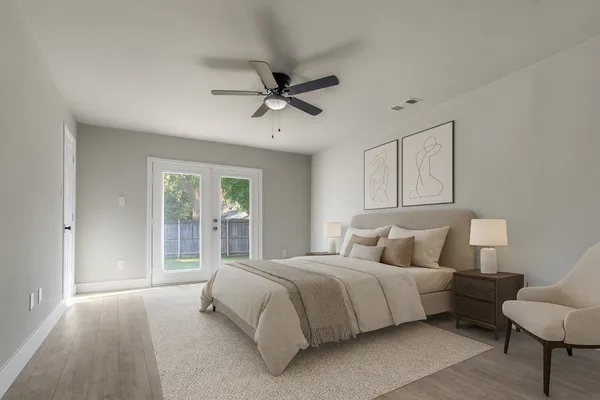 a bedroom with bed and window