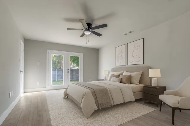 a bedroom with bed and window