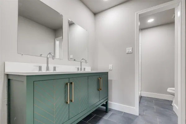 a bathroom with a sink and mirror
