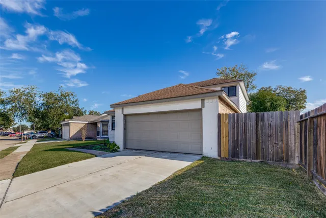 a view of a backyard of the house