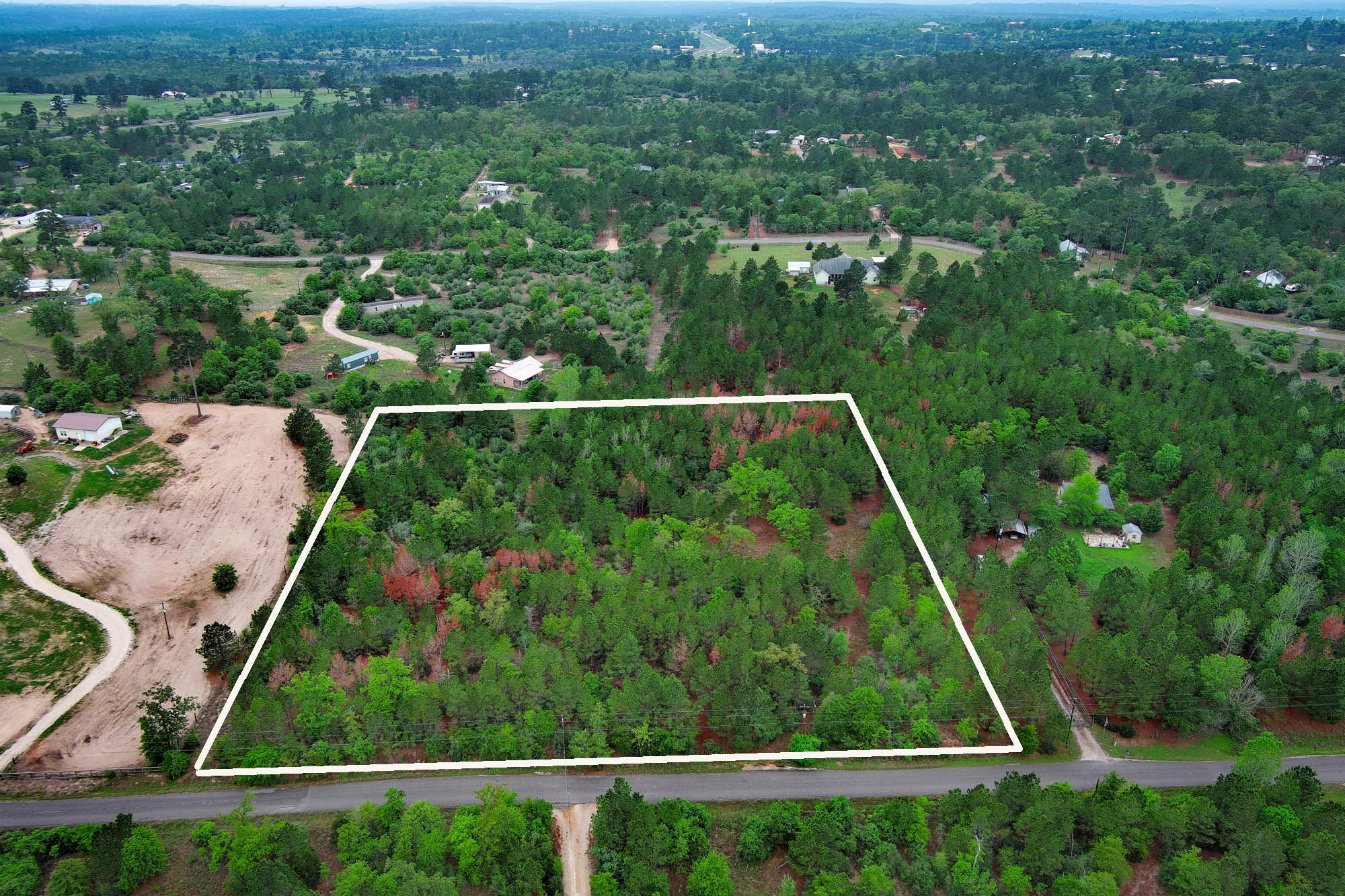 453 Kelley Road East Bastrop, TX 78602 - Photo 4 of 20 an aerial view of residential houses with outdoor space and trees