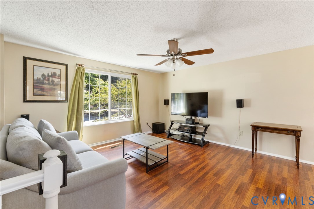 100 Moorwood Ridge Drive Chesterfield, VA 23236 - Photo 3 of 24 a living room with furniture wooden floor and a flat screen tv