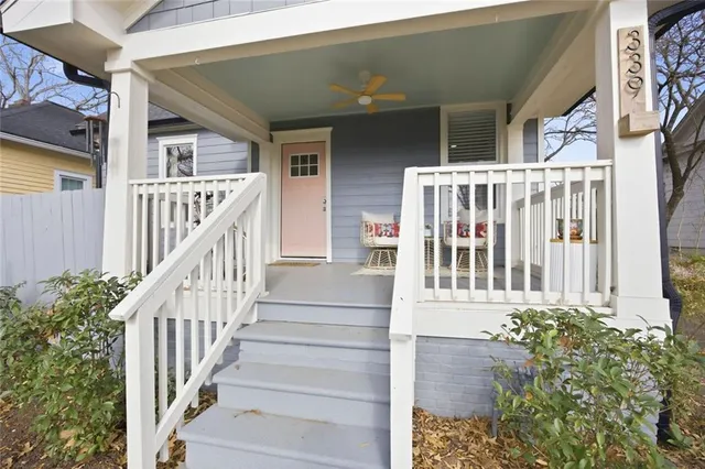 a view of a house with wooden floor and stairs