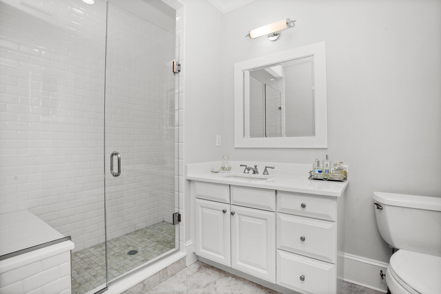 3 Half Mile Road Darien, CT 06820 - Photo 28 of 49 a bathroom with a toilet a sink a glass door a shower and mirror