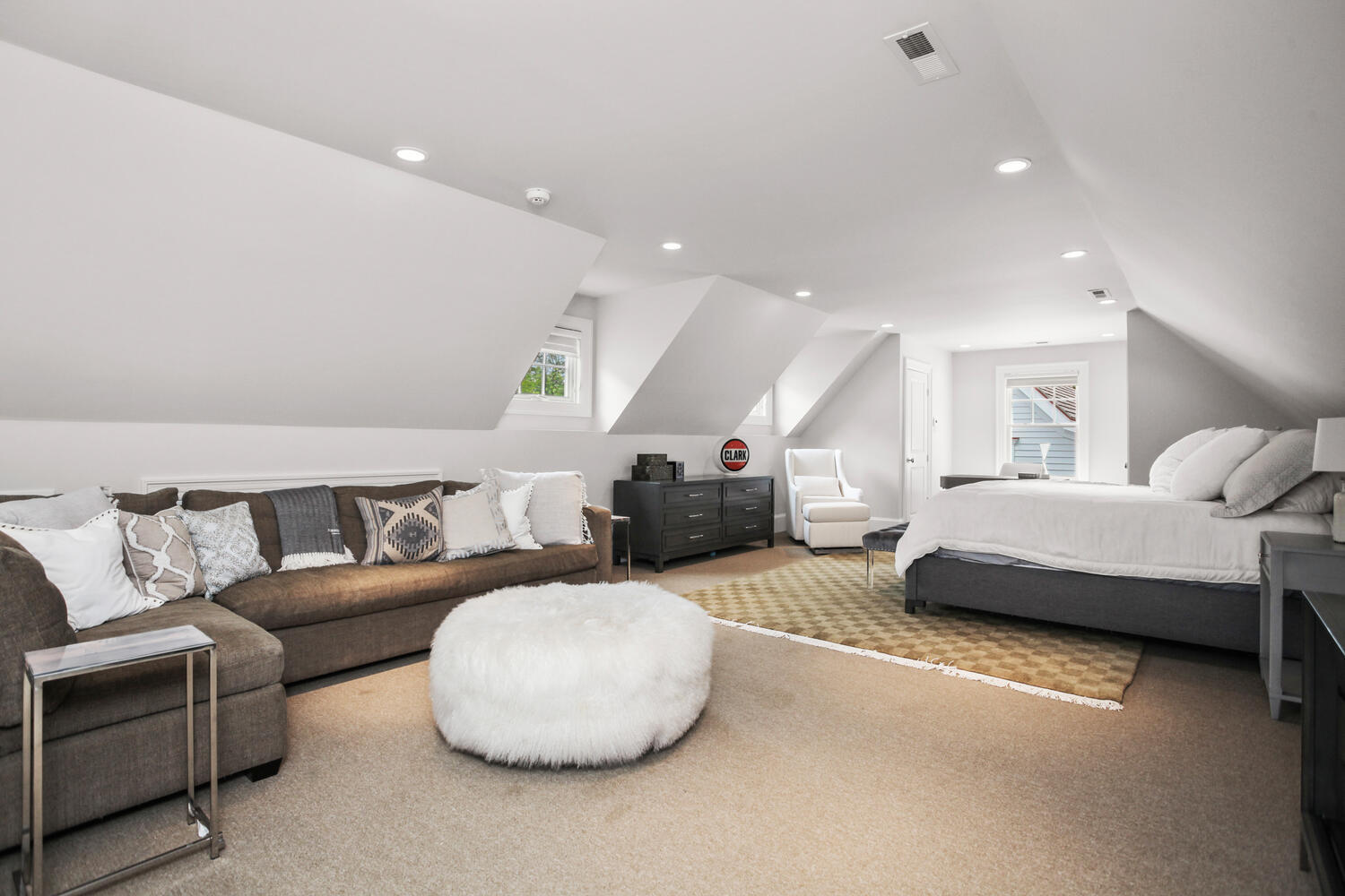 3 Half Mile Road Darien, CT 06820 - Photo 32 of 49 a spacious bedroom with a bed and couch