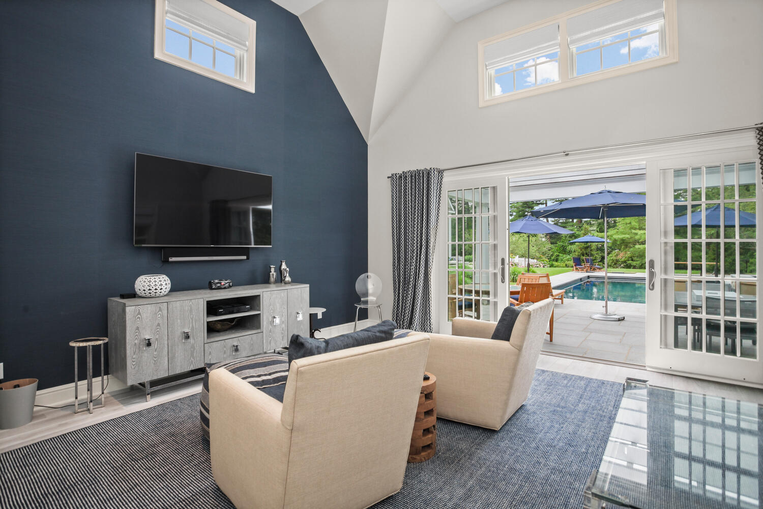 3 Half Mile Road Darien, CT 06820 - Photo 41 of 49 a living room with furniture and a flat screen tv