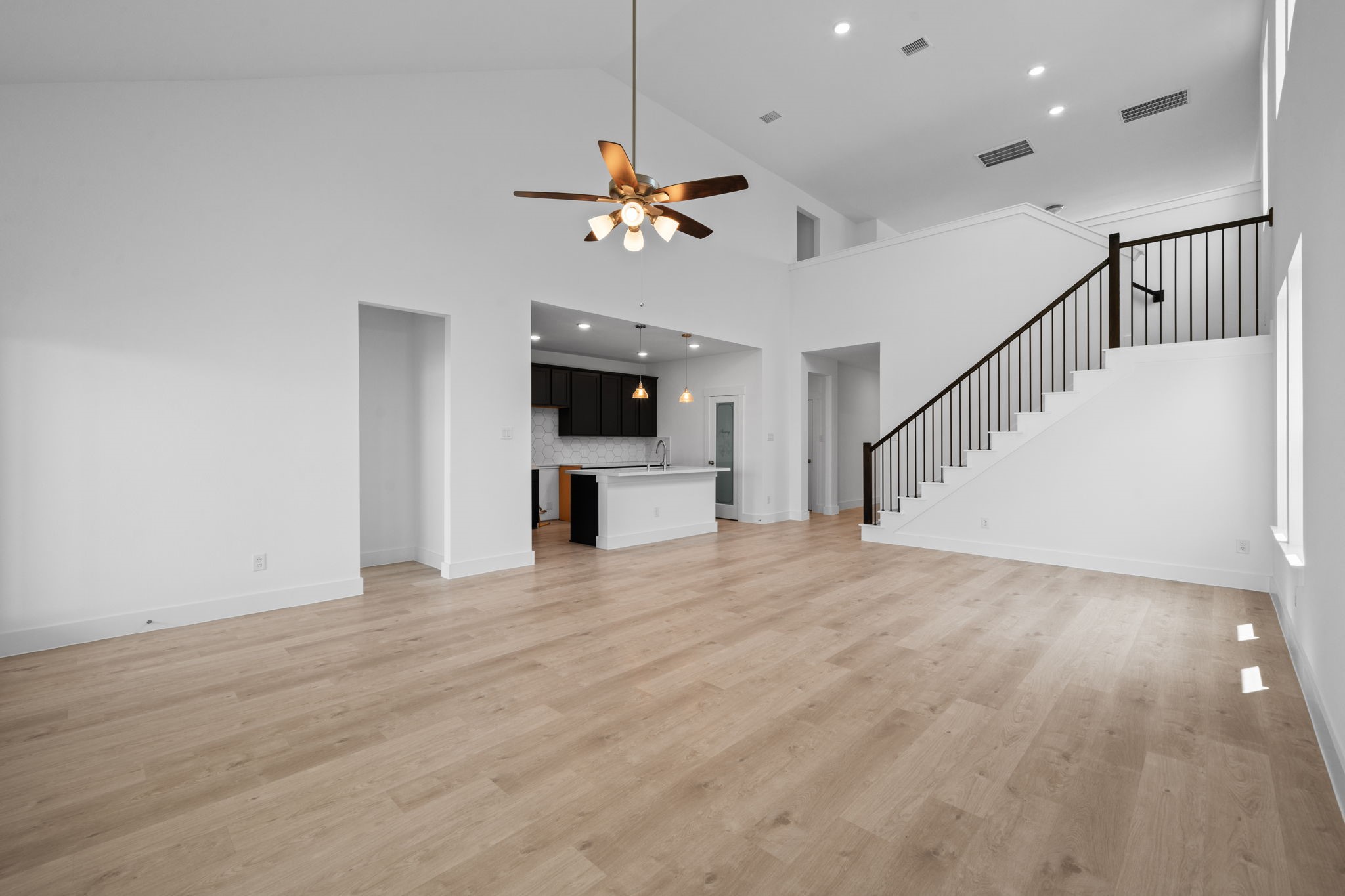 309 Gambels Quail Road Waller, TX 77484 - Photo 5 of 27 Imagine walking into a home that feels as expansive as it is inviting, bathed in natural light and framed by soaring ceilings that make every moment feel grand.