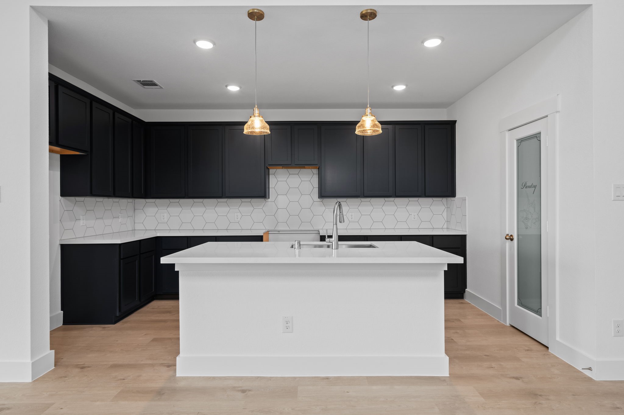309 Gambels Quail Road Hempstead, TX 77445 - Photo 6 of 27 a kitchen with stainless steel appliances granite countertop a stove and a sink