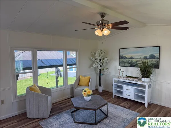 a living room with furniture and a window