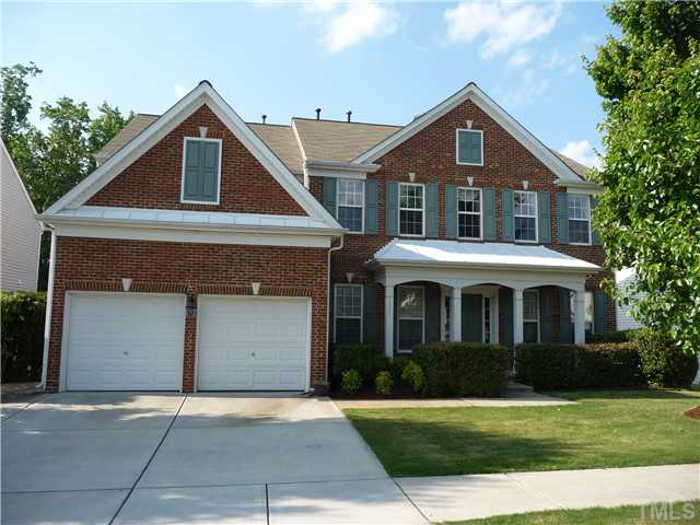 7557 Silver View Lane Raleigh, NC 27613 - Photo 1 of 25 a front view of a house with a yard and garage