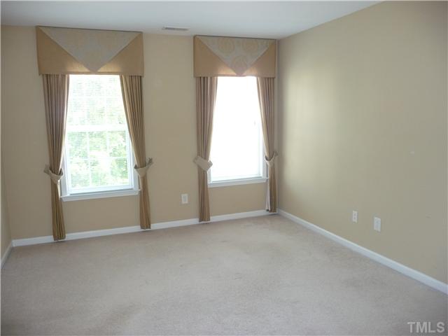 7557 Silver View Lane Raleigh, NC 27613 - Photo 14 of 25 an empty room with windows