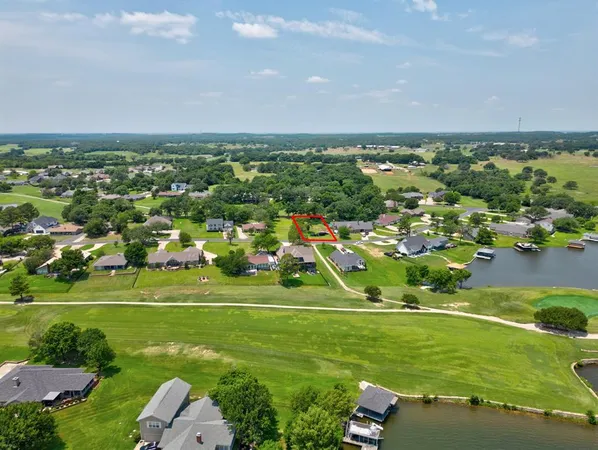 an aerial view of a houses with outdoor space and street view