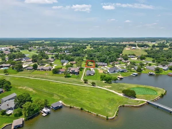 an aerial view of a house with a swimming pool