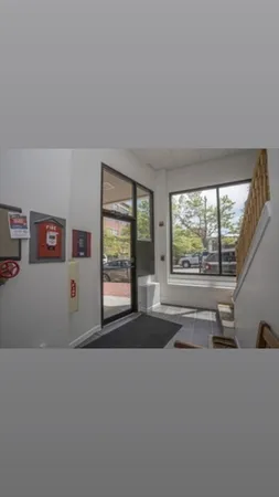 a view of an entryway with wooden floor