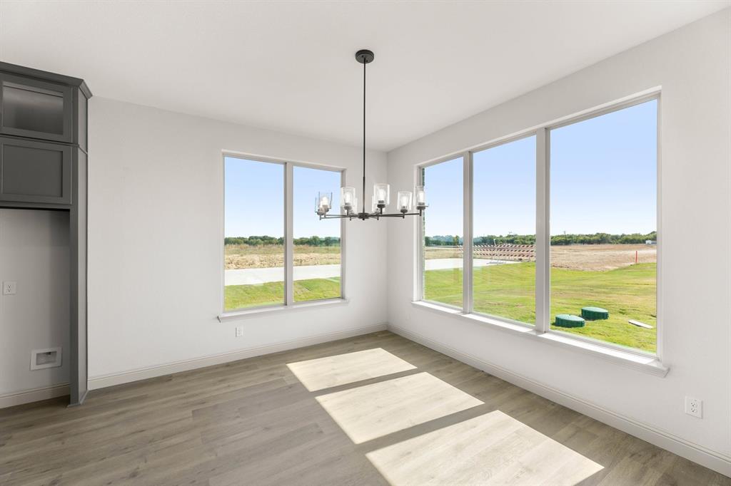 136 Evanston Court Rhome, TX 76078 - Photo 11 of 28 136 Evanston-Dining-1