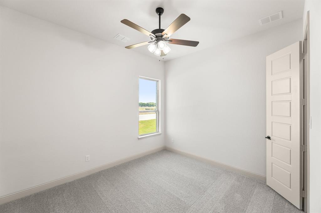 136 Evanston Court Rhome, TX 76078 - Photo 24 of 28 136 Evanston-Bedroom-2