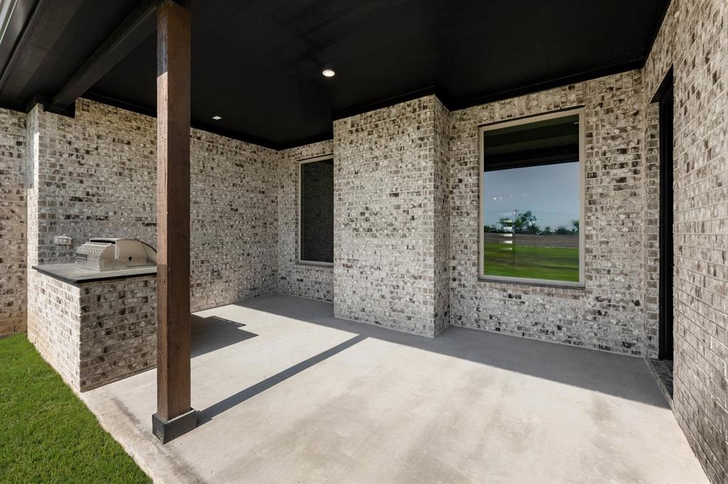 136 Evanston Court Rhome, TX 76078 - Photo 26 of 28 136 Evanston-Patio-1