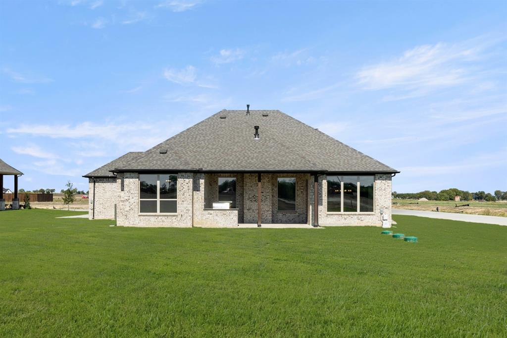136 Evanston Court Rhome, TX 76078 - Photo 27 of 28 136 Evanston-Back-2