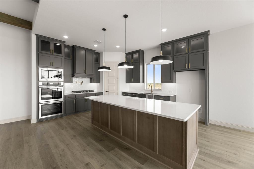 136 Evanston Court Rhome, TX 76078 - Photo 7 of 28 136 Evanston-Kitchen-2