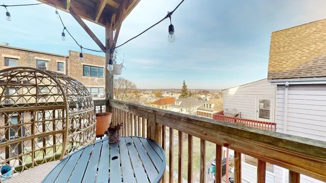 a view of a balcony with wooden floor