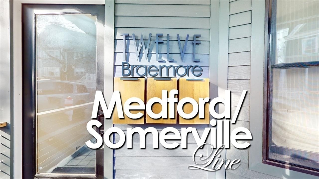 12 Braemore Road, Unit 2 Medford, MA 02155 - Photo 23 of 24 a sign board with a window