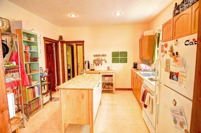 a view of a kitchen with furniture and a kitchen