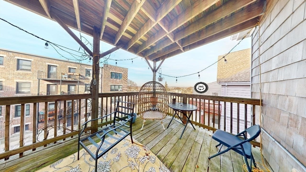 12 Braemore Road, Unit 2 Medford, MA 02155 - Photo 6 of 19 a view of a porch with furniture