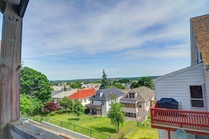 12 Braemore Road, Unit 2 Medford, MA 02155 - Photo 6 of 24 a view of a city from a balcony