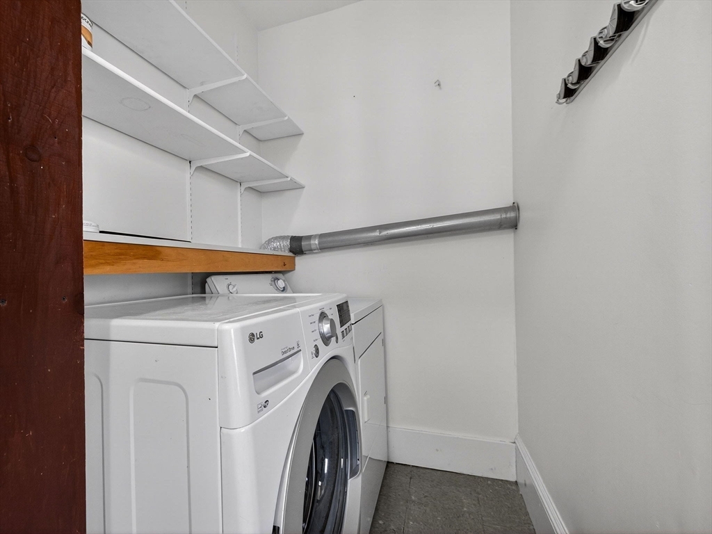 12 Braemore Road, Unit 2 Medford, MA 02155 - Photo 8 of 24 a utility room with dryer and washer