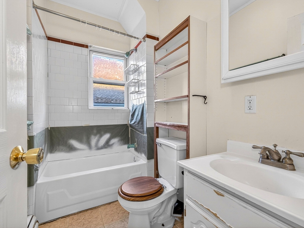 12 Braemore Road, Unit 2 Medford, MA 02155 - Photo 9 of 24 a bathroom with a sink and a bathtub