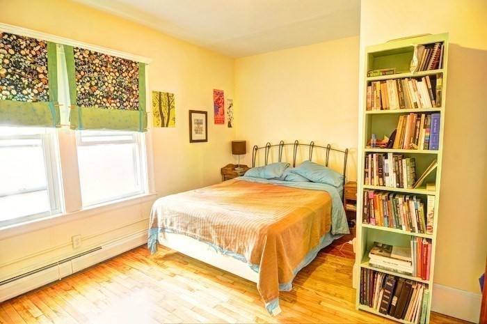 12 Braemore Road, Unit 2 Medford, MA 02155 - Photo 10 of 19 a bedroom with a bed and a window