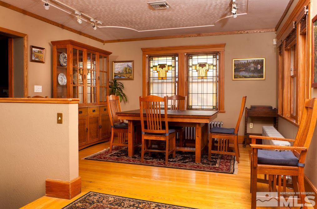 19 Winter Street Reno, NV 89503 - Photo 18 of 40 a view of a dining room with furniture a chandelier and wooden floor